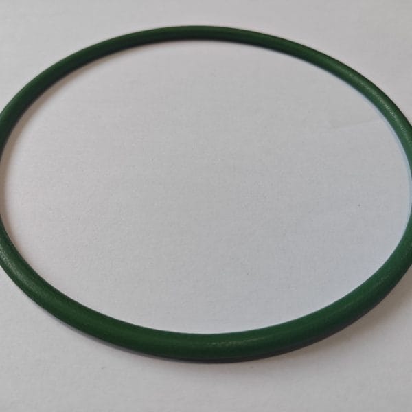 A green Movendis Molded PU Belt lies flat on a white surface, casting a subtle shadow.